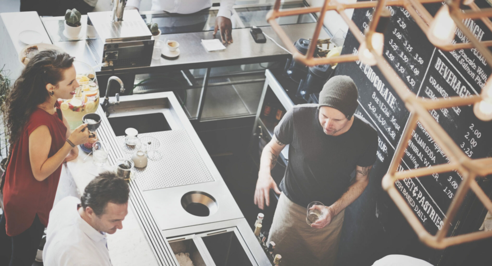 Group of diverse people ordering coffee cafe shop